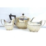 A Victorian hallmarked silver three-piece tea set comprising teapot, milk jug and sugar bowl,