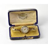 ROLEX; a 9ct gold wristwatch, the circul