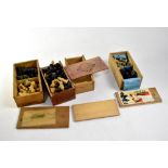 Four vintage wood chess set boxes containing complete and incomplete chess sets (4).