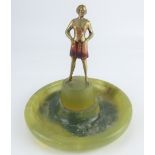 An Art Deco bronze figure of a woman on