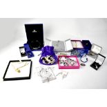 SWAROVSKI; a quantity of boxed jewellery to include white metal crystal pendant,