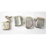 Four hallmarked silver vestas, three rectangular examples and one lozenge-shaped example,