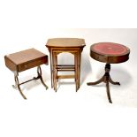 A Georgian-style mahogany leather-topped drum table, an Edwardian-style nest of tables,