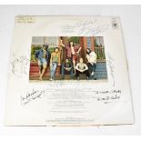 BRUCE SPRINGSTEEN; 'The Wild, the Innocent and the E Street Shuffle' LP, bearing several signatures.