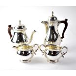 An Elizabeth II hallmarked silver four-piece tea set of baluster form, with gadrooned borders,