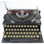 THE IMPERIAL; a cased vintage black bodied metal typewriter.