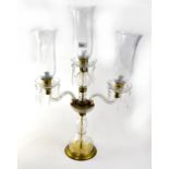 A glass and gilt metal three-branch candelabrum-style lamp,