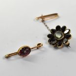 Two early 19th century brooches comprising a rose gold bar brooch with bezel set half garnet