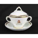 An early 19th century porcelain twin-handled chocolate cup, cover and saucer,