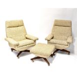 A pair of 1960s swivel reclining armchairs upholstered in a woven mushroom-coloured fabric,