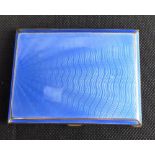 An Art Deco gilt metal and engine turned blue enamel cigarette box, 8.5 x 6.5cm.