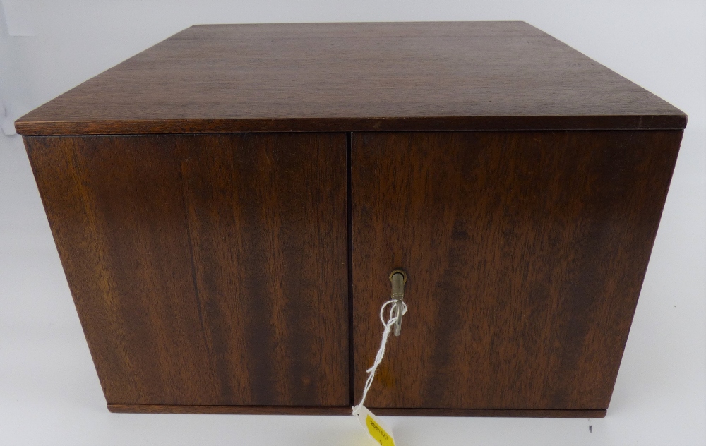 A mahogany coin collectors' tabletop cabinet with fourteen slide-out drawers,