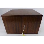 A mahogany coin collectors' tabletop cabinet with fourteen slide-out drawers,