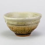 MIKE DODD (born 1943); a stoneware bowl covered in pale green ash and granite glaze, impressed MJD