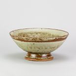 RICHARD BATTERHAM (1936-2021); a large stoneware tazza covered in green ash and kaki glaze, diameter