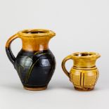 CLIVE BOWEN (born 1943); a slipware jug covered in chestnut glaze with trailed decoration and