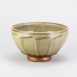 RICHARD BATTERHAM (1936-2021); a stoneware cut sided bowl covered in green ash and kaki glaze,