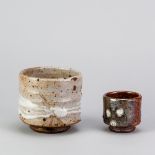 STEVE BOOTON (born 1957); a stoneware yunomi partially covered in shino glaze, impressed SB mark,