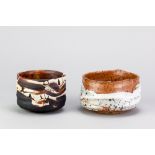 STEVE BOOTON (born 1957); a stoneware chawan partially covered in shino glaze, impressed SB mark,