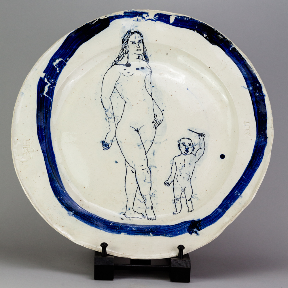 PHILIP EGLIN (born 1959); a large earthenware plate covered in white glaze with cobalt painted