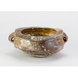 NIC COLLINS (born 1958); a wood fired stoneware twin handled bowl covered in shino glaze, incised