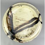 DYLAN BOWEN (born 1967); a large slipware platter/wall plaque covered in pale yellow glaze with iron