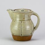 MIKE DODD (born 1943); a stoneware lobed coffee pot covered in pale green ash glaze, impressed MJD