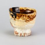 SIMON CARROLL (1964-2009); an earthenware teabowl covered in coloured slips and glazes with