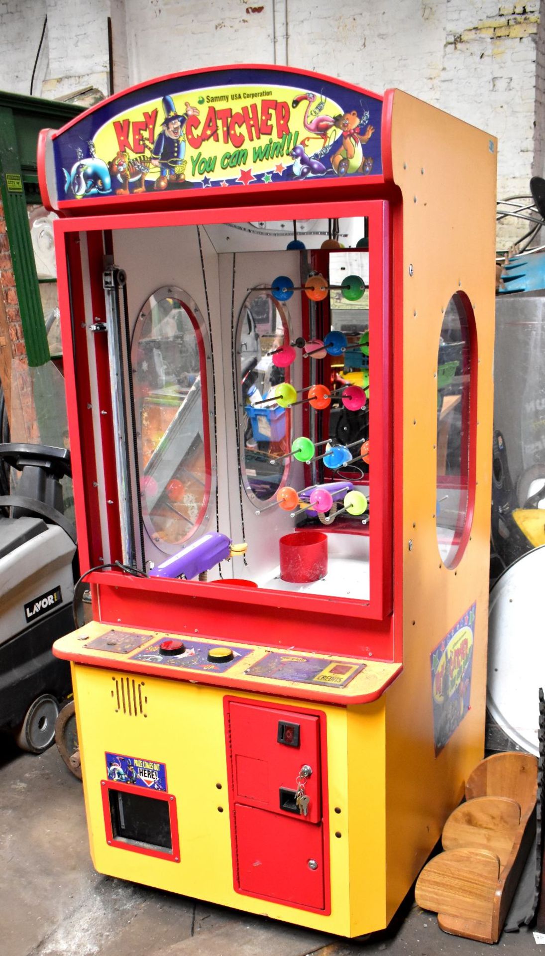 SAMMY USA CORPORATION; a Key Catcher arcade machine (af, sold electrically untested).