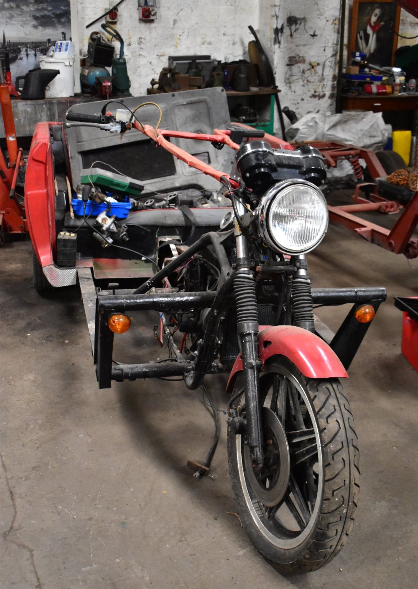 A custom-built trike based on a Reliant Robin, with Reliant Robin running gear and Honda front end.