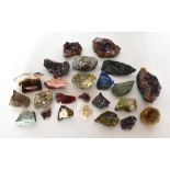 A collection of specimen stones including amethyst, topaz, quartz, lapiz, etc