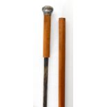 A late 19th century malacca sword stick, the blade with niello type decoration with white metal