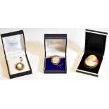 Three 9ct gold mounted cameo style brooches including an example of oval form decorated with the '