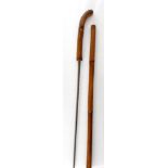 An early 20th century bamboo sword stick, the blade indistinctly stamped Leon, length 90cm.
