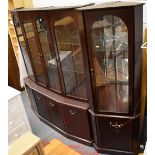 A contemporary mahogany veneered lounge unit with four glazed upper doors above four lower cupboard