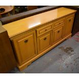 A reproduction sideboard with two drawers and four cupboard doors, width 172cm.