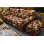 A good quality two-seater floral upholstered settee and matching pouffe (2).