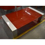 A red glass and silvered metal rectangular low coffee table, length 124.