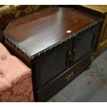 A contemporary mahogany television stand with twin glazed doors and cupboard beneath, width 71cm.