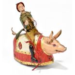 LEHMANN; a German tinplate clockwork model of a man riding a pig, the figure with cotton clothes,
