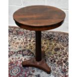 A 19th century rosewood occasional table, the circular tilt-top on a faceted column with triform