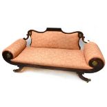 A Regency Irish stained beech scroll end settee with gilt metal floral mounts on swept legs,