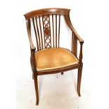 An Edwardian mahogany and boxwood strung salon chair, height 90cm.