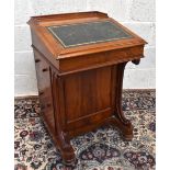 A late 19th century mahogany Davenport with galleried back above the slope, enclosing four drawers