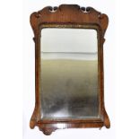 A George III walnut fret frame wall mirror, with gilt detailing and bevelled plate, height 93cm,
