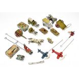 A collection of seven tinplate army toys comprising a German first aid wagon and two horses,
