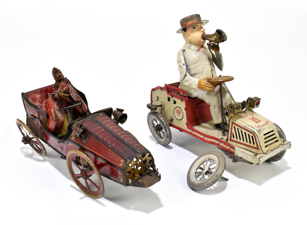 LEHMANN / DRGM; a German tinplate clockwork Tut Tut car, with original key and bellows, length 17.