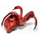 ROYAL DOULTON; a flambé figure from the Images of Fire collection 'Nestling Down', height 20cm.