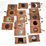 MAGIC LANTERN SLIDES; a collection of fourteen Victorian mechanical magic lantern slides to