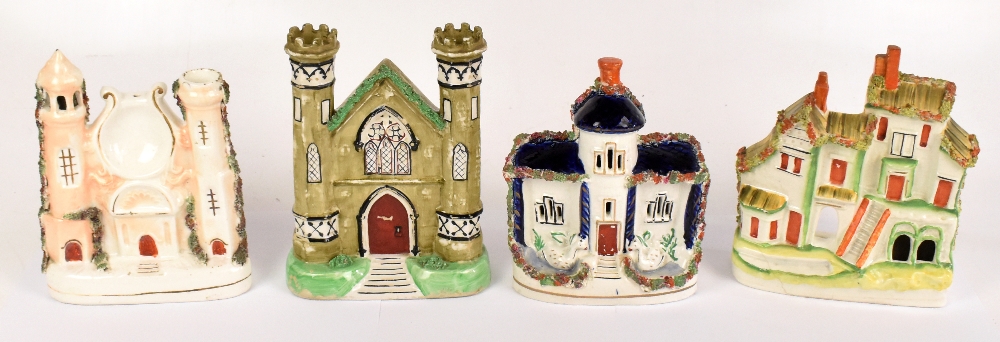 Four 19th century Staffordshire pastille burners, height of largest example 21cm (4).Additional